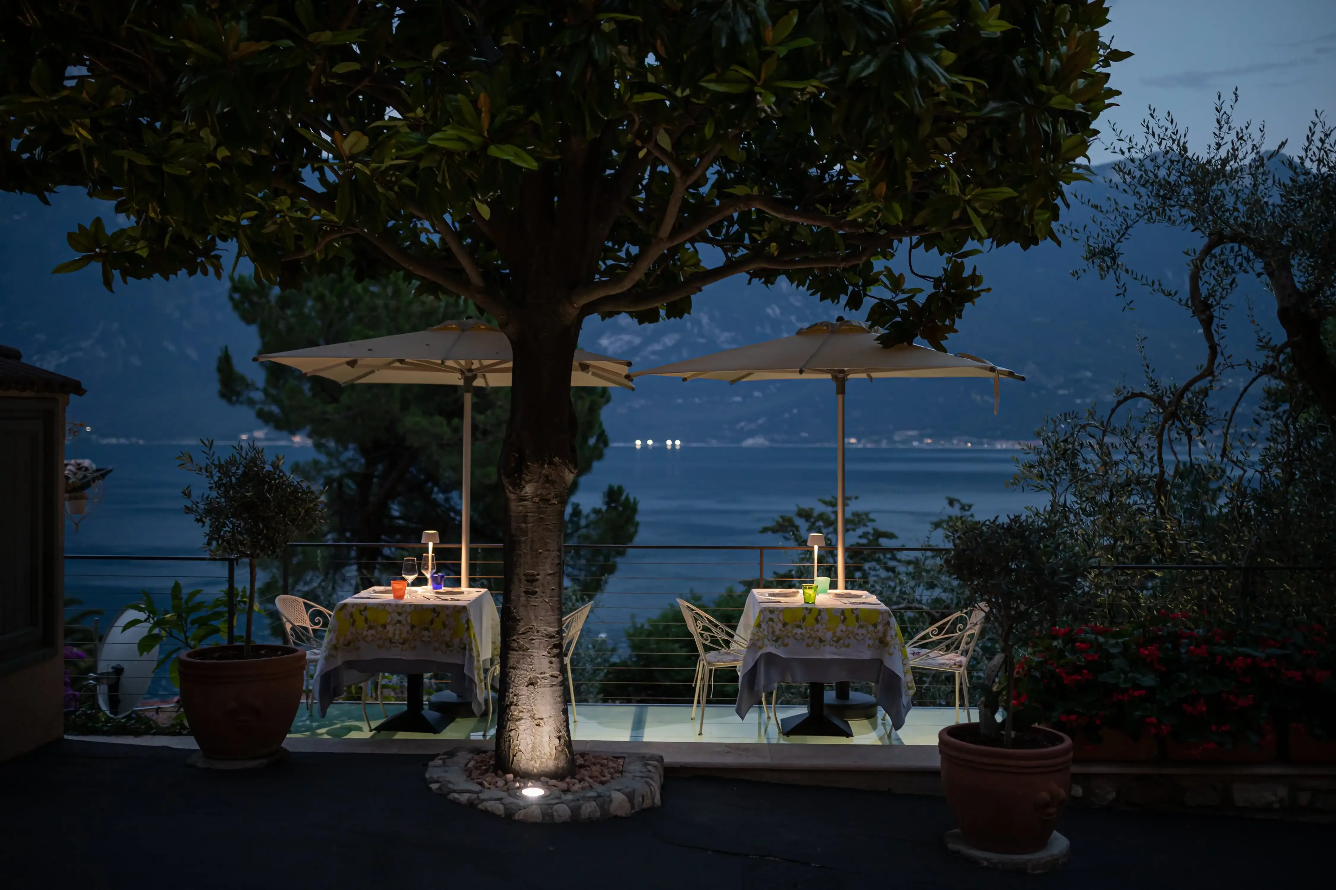 Romantic evening dining setup overlooking the lake